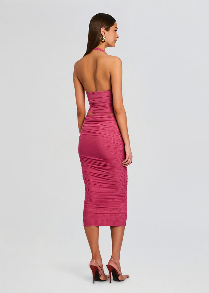 Back view of a pink ruched mesh halter top on a model with the neck strap visible media 5 of 5