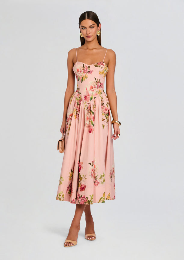 Pink floral corseted midi dress with spaghetti straps and a full pleated skirt.