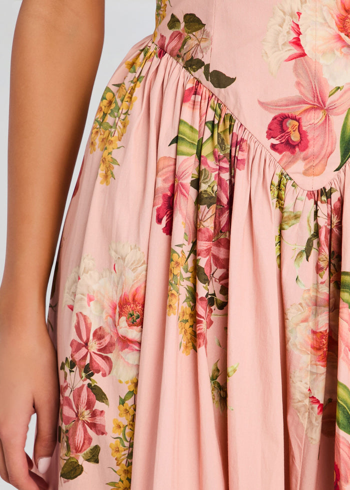 Close-up of pink floral dress fabric showing a gathered waist seam and pleats. media 2 of 5