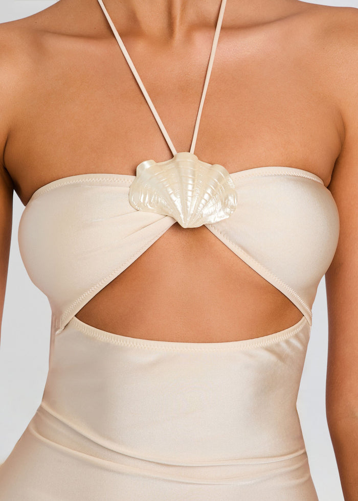 Close-up of beige bandeau top featuring a seashell knot and halter neck strap. media 2 of 5