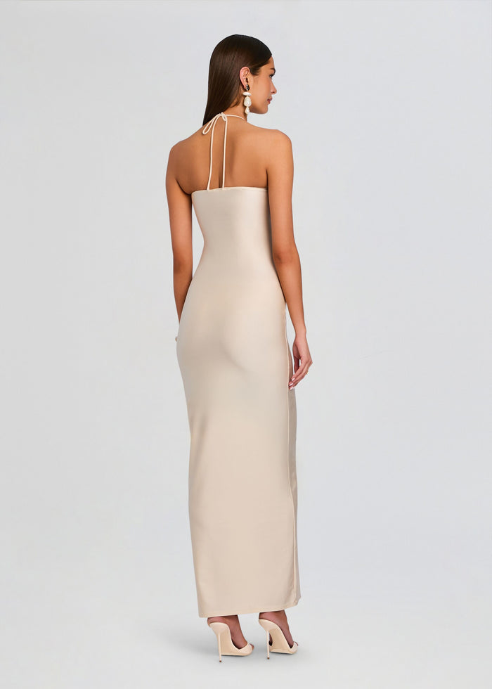 Back view of a cream halter neck maxi dress with thin straps tied at the back of the neck media 4 of 5