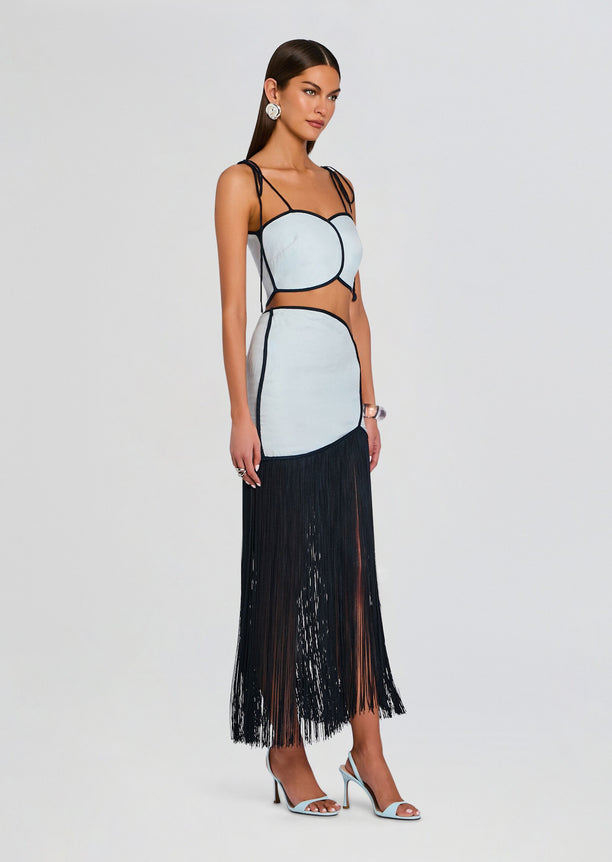 Model wearing Joelle Skirt with light blue panels and long black fringe hem