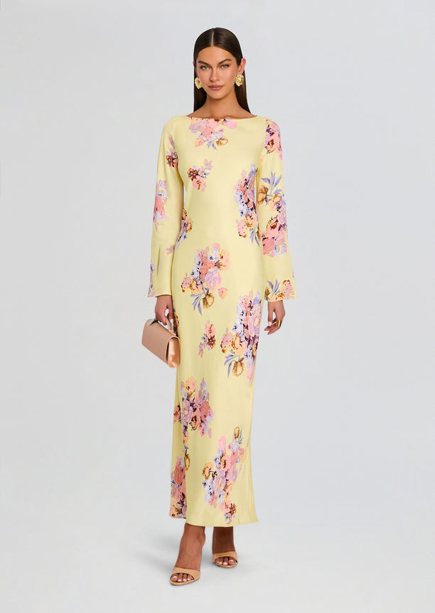Kysha Long Bias Dress in pale yellow floral print with long sleeves worn by a model