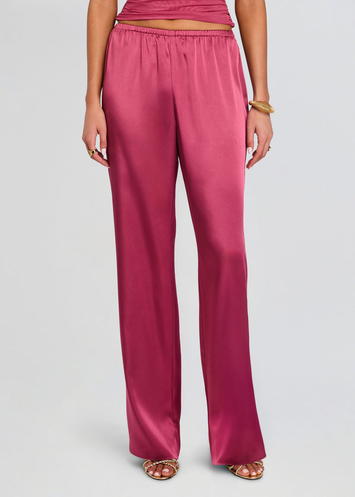 Full-length magenta satin pants with an elastic waistband and wide legs media 1 of 5