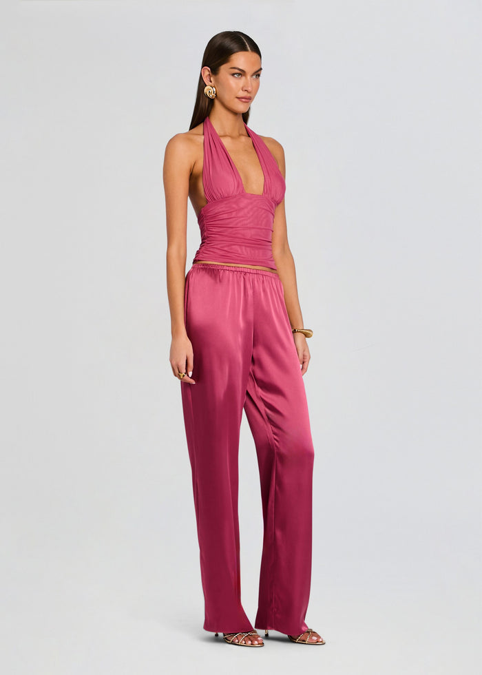 Model wearing the Lillian Satin Pant set with a pink halter top and matching satin wide leg pants media 4 of 5