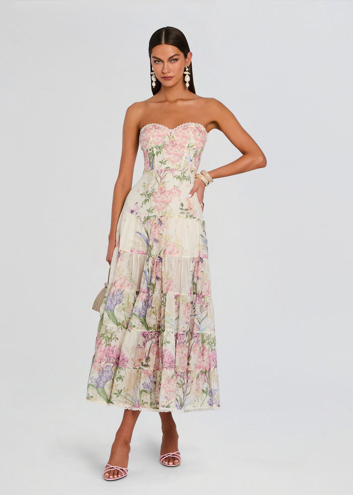 Full length of a floral Danny Long Dress on a model with a strapless sweetheart neckline, fitted bodice, and flowing tiered skirt. media 1 of 5