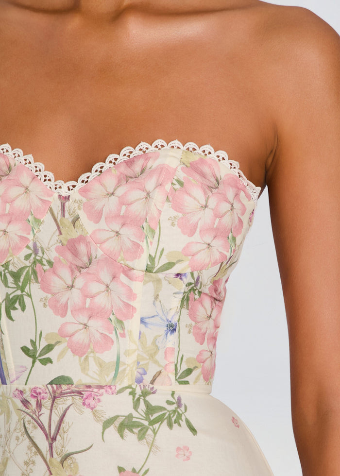 Close-up of a strapless floral dress bodice with white lace trim media 2 of 5