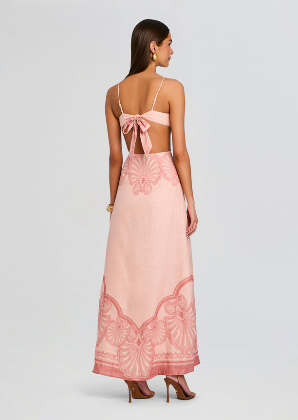 Back view of blush pink Maya Maxi Dress with thin straps and a bow at the open back