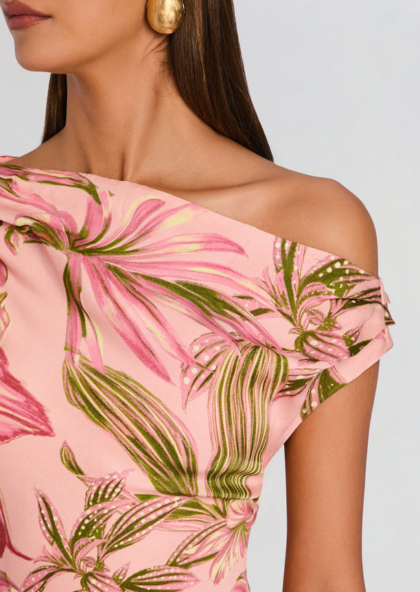Close-up of the pink tropical print and off-shoulder neckline on the Cain One Shoulder Maxi Dress.
