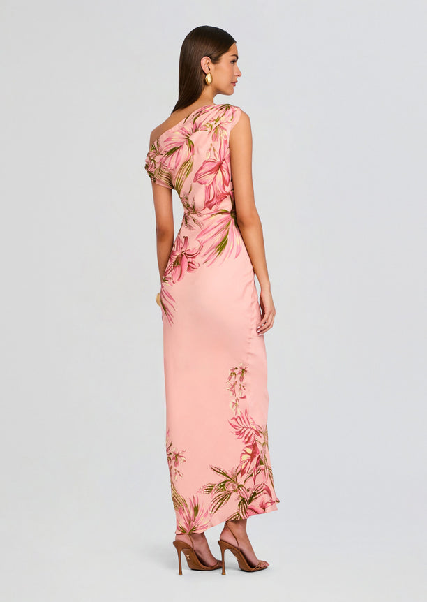 Back view of pink tropical print one shoulder maxi dress showing shoulder drape