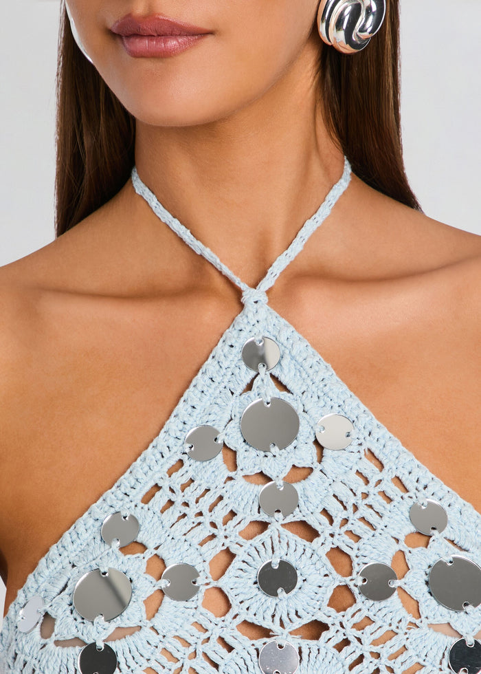 Light blue crochet halter dress bodice with circular silver discs along the front media 2 of 5