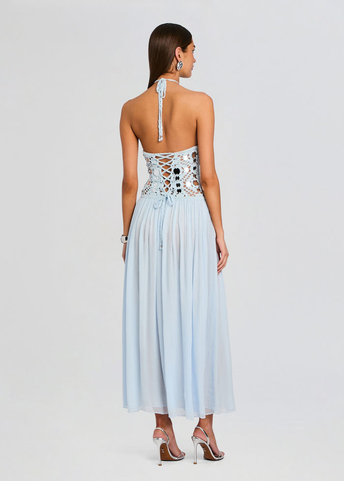 Back view of light blue crochet dress showing a lace up bodice and halter tie with a flowing skirt media 4 of 5