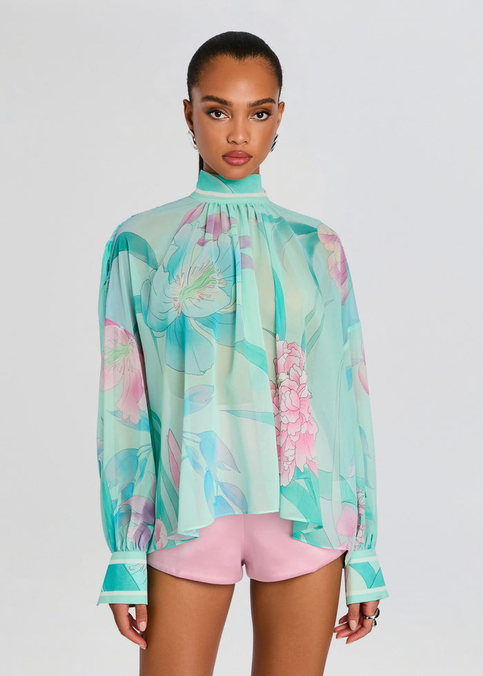 Close up of Olympia Top turquoise floral blouse with gathered high neck and flowing silhouette. media 6 of 7