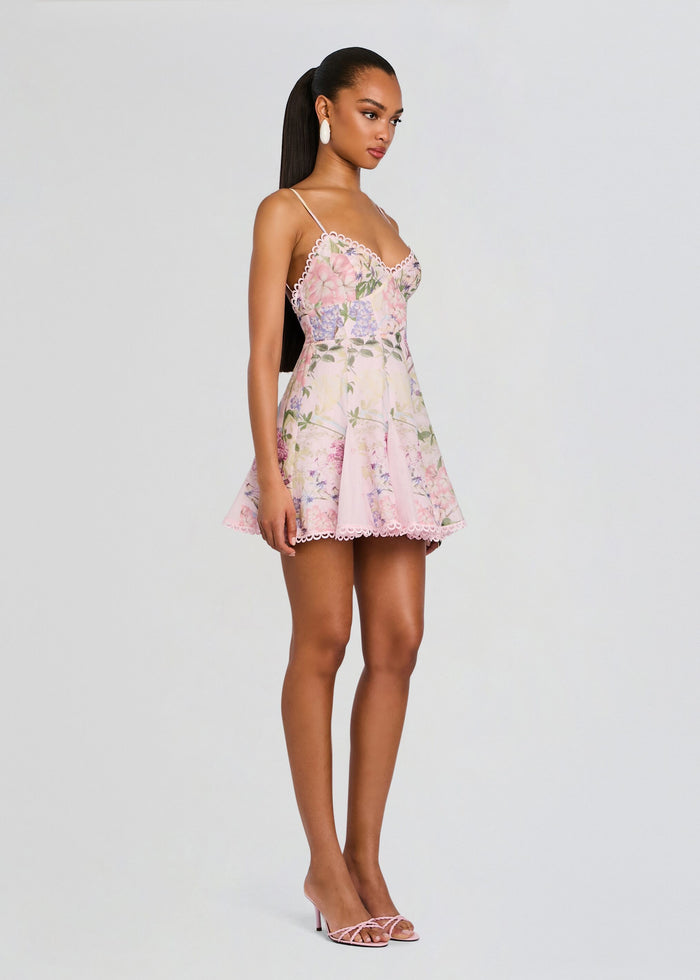 Front view of a model wearing a pink floral Marlene Short Dress with lace trim and spaghetti straps. media 3 of 5