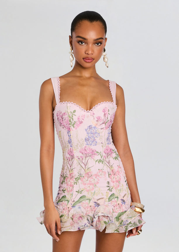 Model wearing Sunil Short Dress in pink floral print with scalloped lace trim
