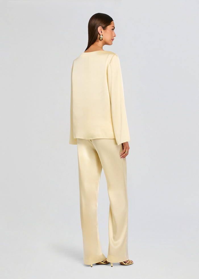 Back view of Blaine Blouse with matching pale cream satin pants. media 5 of 5