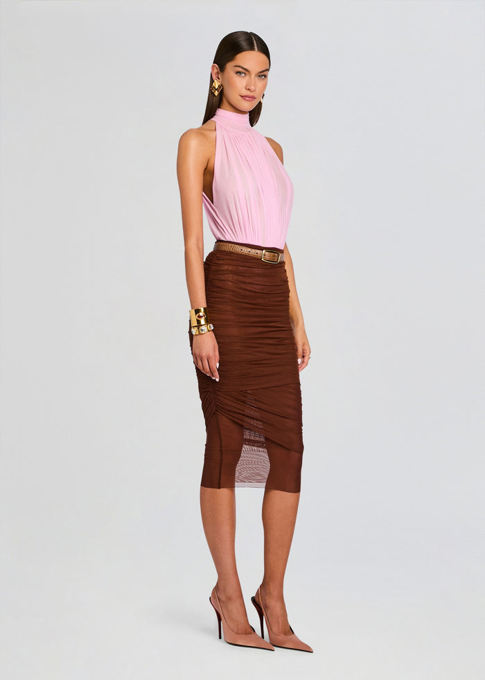 Model wearing a pink pleated halter neck bodysuit tucked into a brown ruched midi skirt with a tan belt and gold jewelry. media 4 of 5