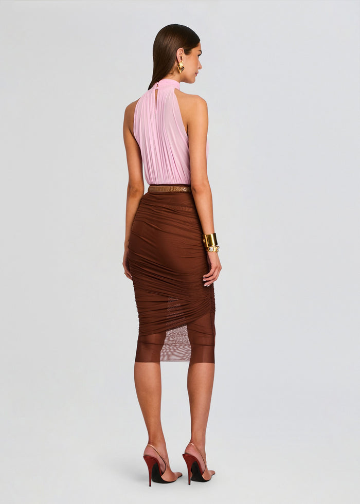Back view of model in pink halter neck bodysuit and brown ruched midi skirt with belt. media 5 of 5