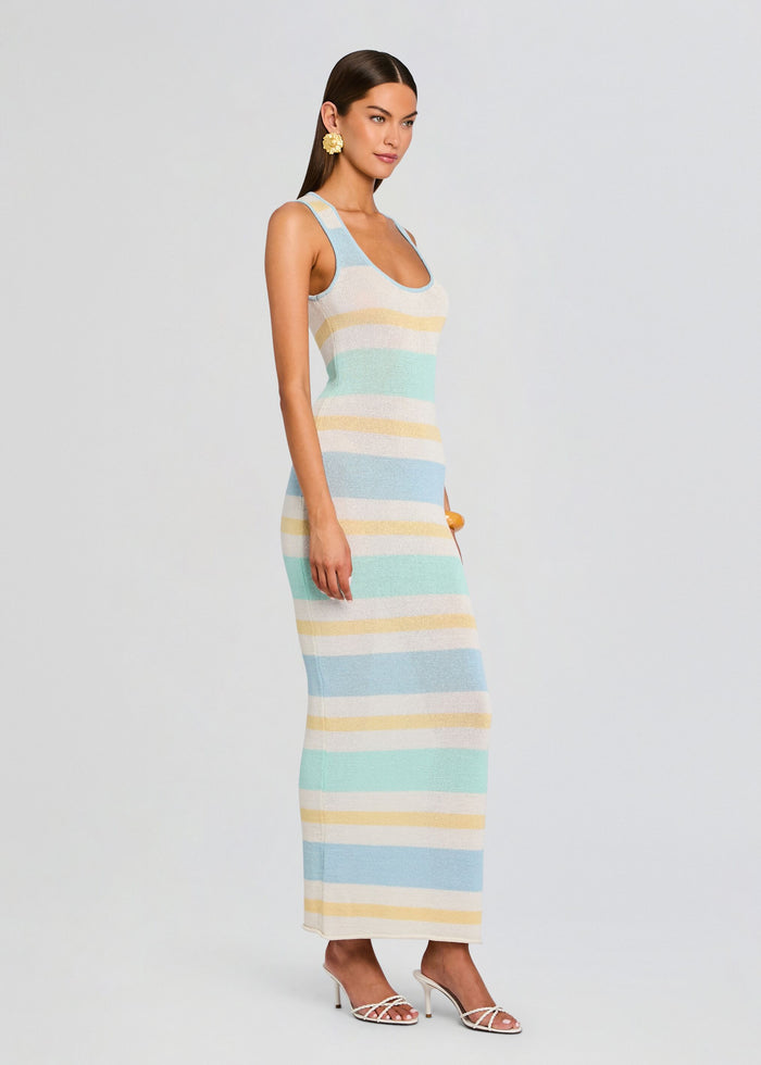 Side view of model wearing Jasmine Knit Dress a sleeveless pastel striped maxi dress in light blue mint cream and pale yellow. media 3 of 5