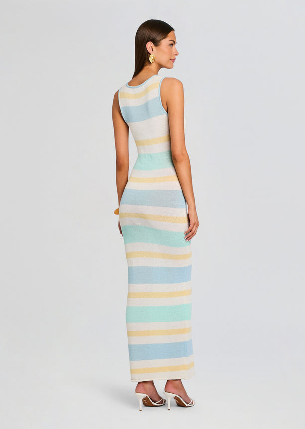 Back view of a model wearing a pastel striped Jasmine Knit Dress, ankle-length.