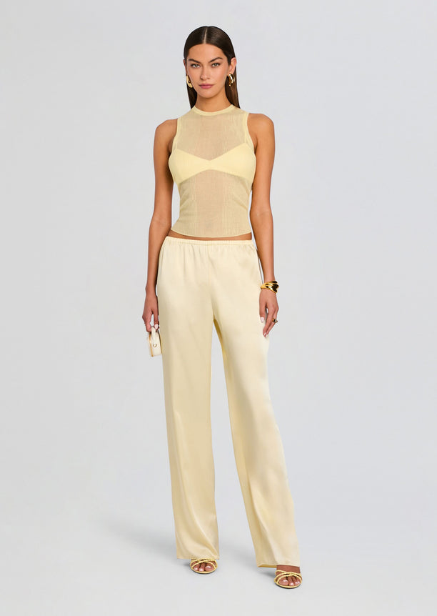 Ivory Jori Rib Knit Tank styled with satin pants and gold accessories