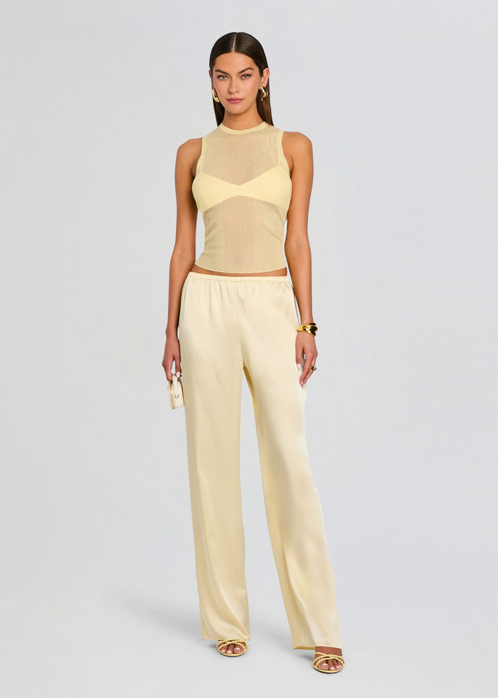 Back view of a pale yellow Courtney Bralette worn under a sheer mesh top with crossback straps media 2 of 5