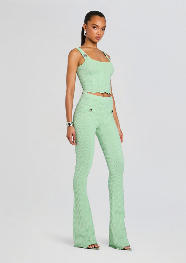 Mint green rib knit crop top with wide straps and matching high-waisted flared pants on a model