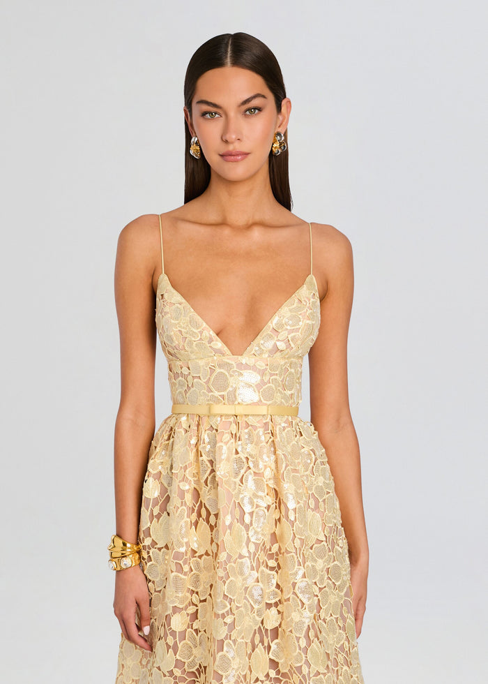 Front view of a champagne sequin lace midi dress with a plunging neckline and thin spaghetti straps belted at the waist media 5 of 5