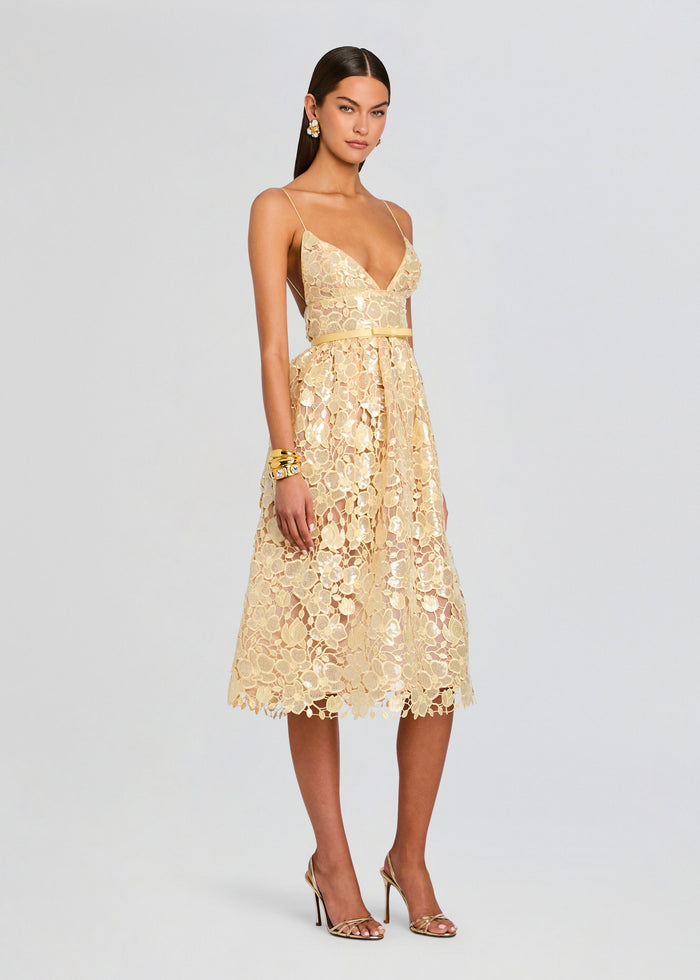 Full-length view of a champagne gold floral lace Eulalia dress with spaghetti straps and a midi skirt. media 3 of 5