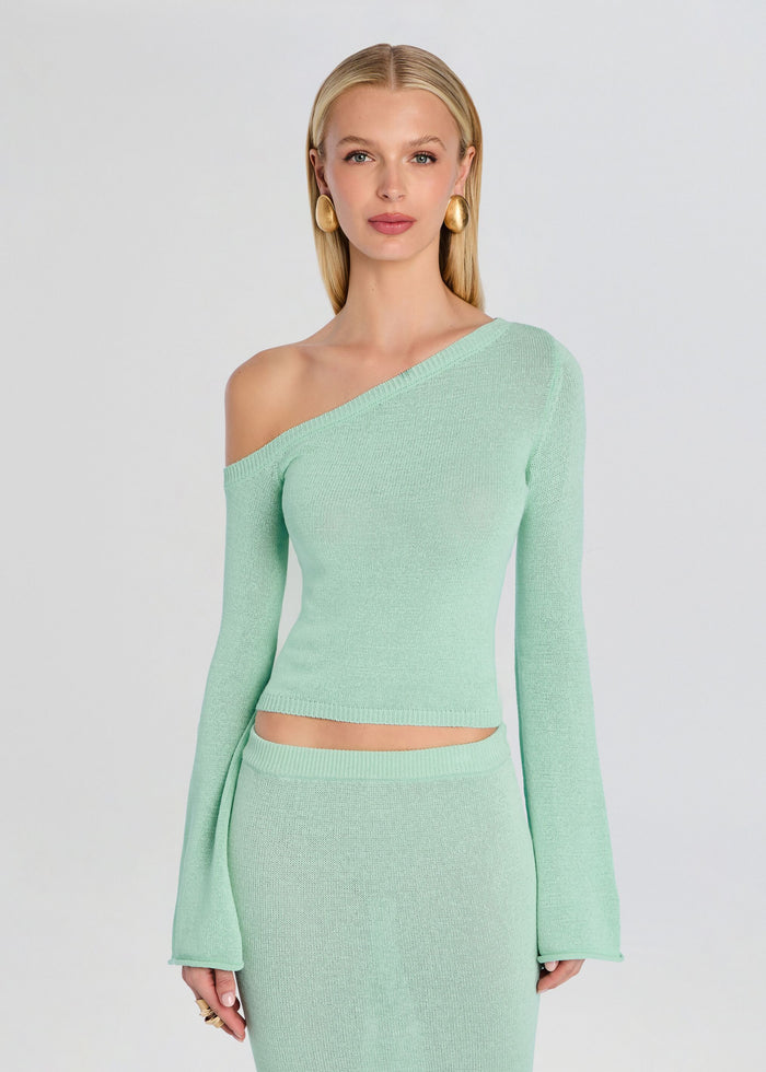 Mint green one-shoulder knit top with long sleeves and a matching knit skirt worn by a model media 1 of 5