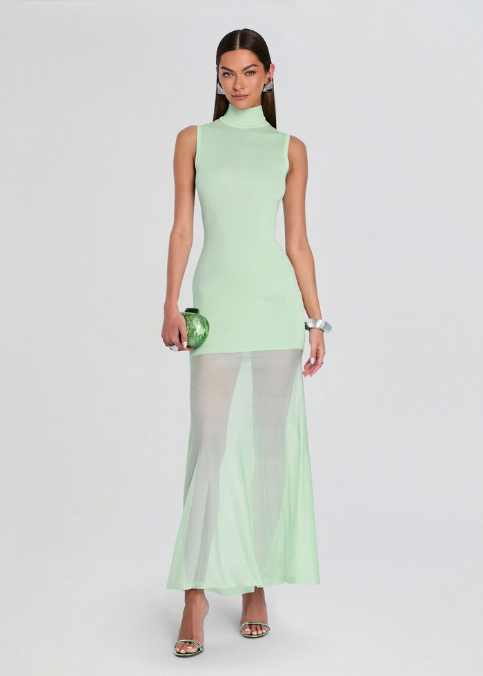 Mint Amine Knit Maxi Dress with sleeveless turtleneck and sheer mesh skirt overlay on a model. media 1 of 5