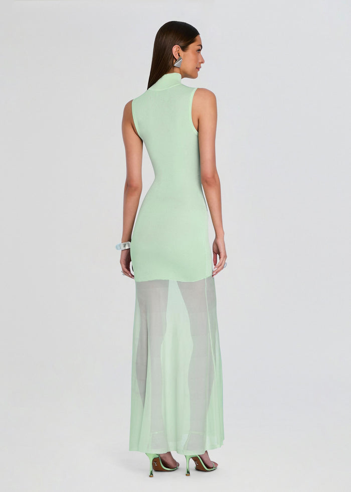 Back view of mint green Amine knit maxi dress on a model, sleeveless turtleneck with sheer hem. media 4 of 5
