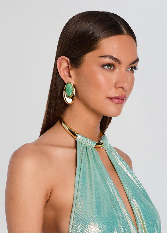 Gold hoop earrings with an oval green stone worn by a model media 5 of 5