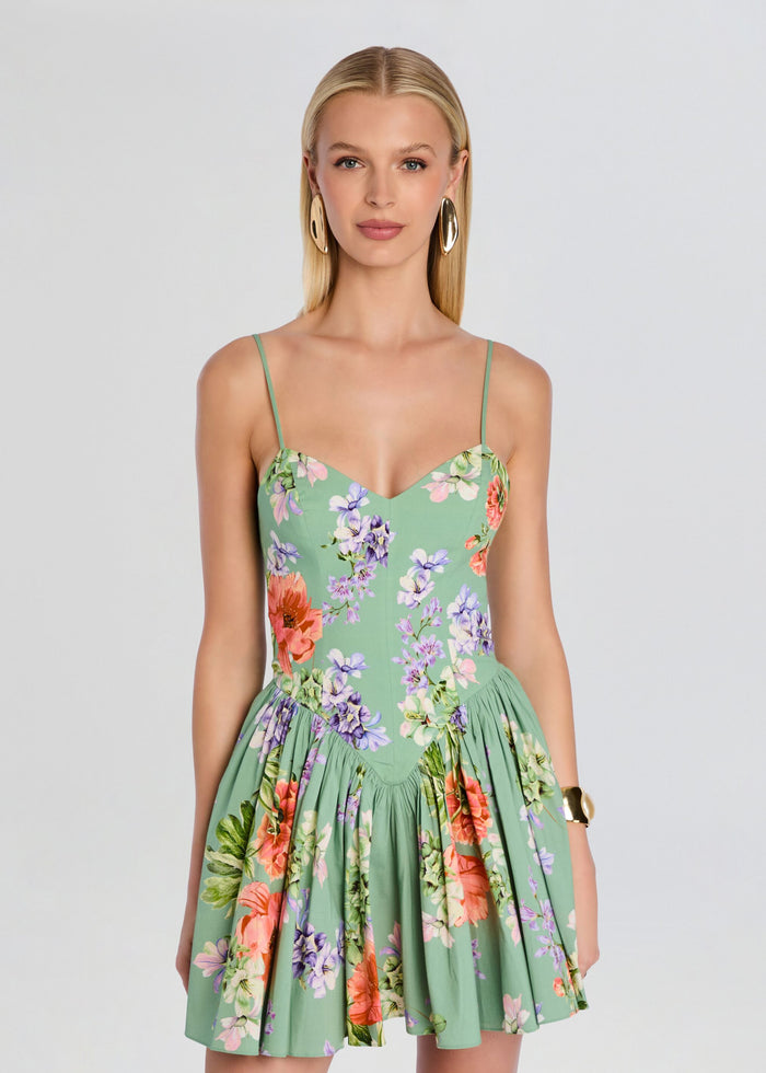 Front view of a model in a green floral Cove Corseted Mini Dress with thin straps and sweetheart neckline media 5 of 5