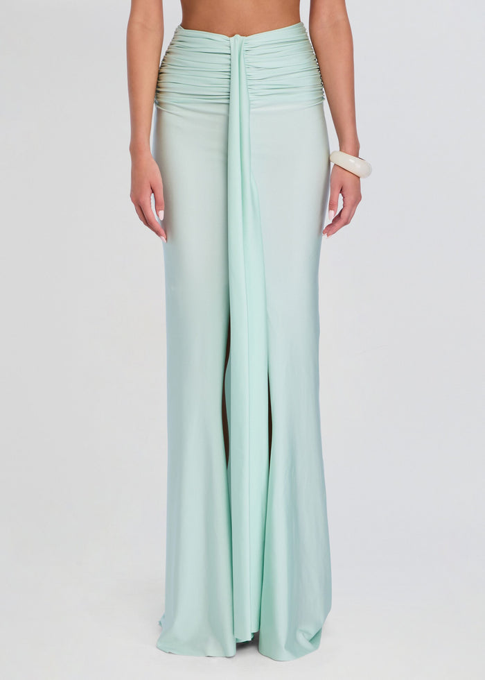 Close up of mint green ruched waistband and long front drape on a maxi skirt media 1 of 5