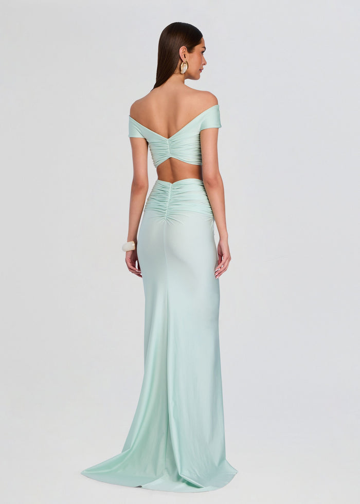 Back view of the mint green off the shoulder ruched crop top and matching high waist maxi skirt. media 5 of 5