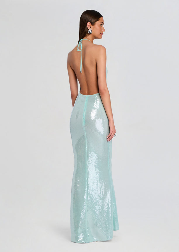 Back view of mint sequin gown with low back and thin halter ties, full-length mermaid silhouette