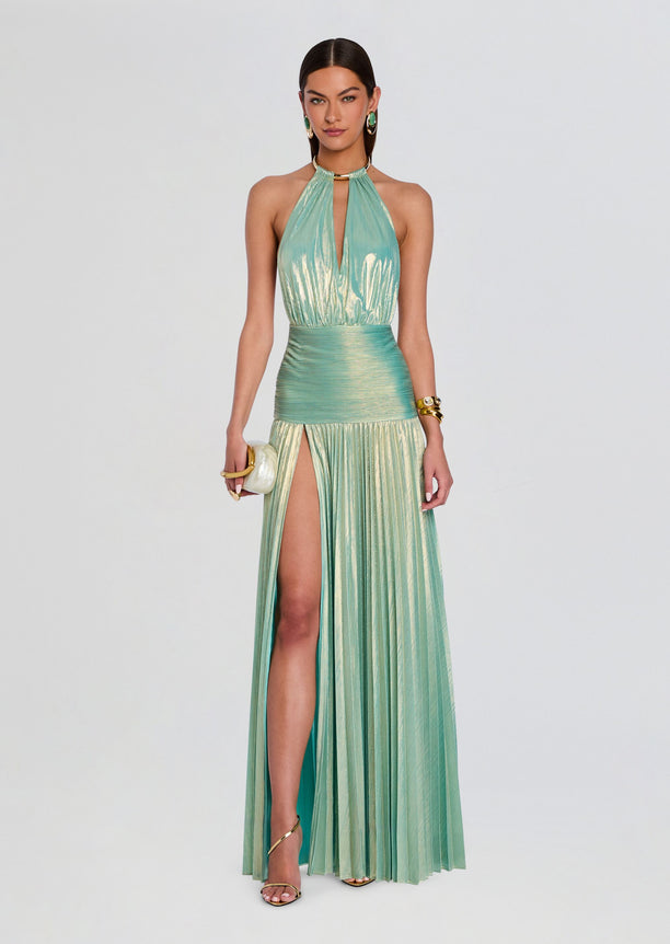 Full-length turquoise Faelina Dress with halter neckline, metallic pleats, and a high slit.