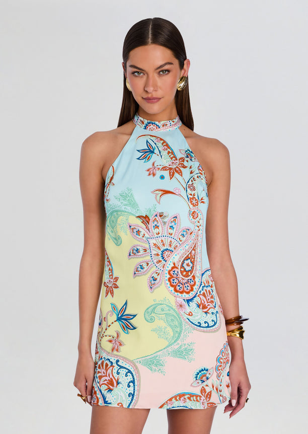 Model wearing a pastel paisley print halter neck mini dress.