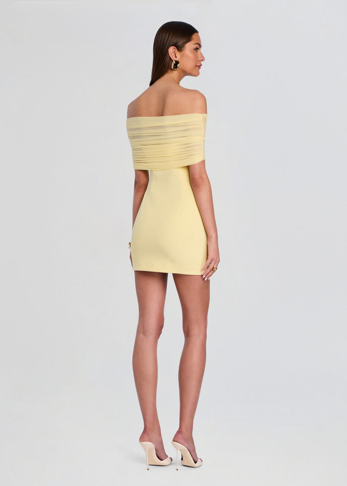Back view of the pale yellow Jayne Mini Dress with an off-shoulder neckline and ruched wrap across the bodice media 4 of 5