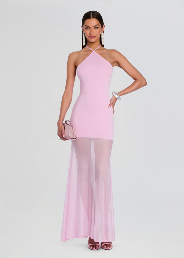 Full length pale pink Jemma Knit Maxi Dress with a halter neckline and sheer overlay; model holds a pink clutch media 1 of 5