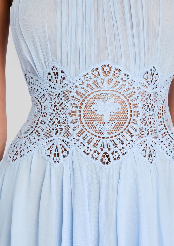 Close up of the Nirvanna Dress waist showing an intricate floral lace overlay and sheer panel