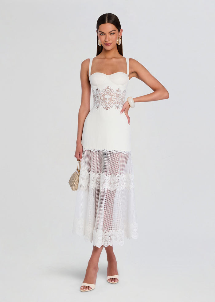 Olenna Dress in white with a lace waist and sheer lace midi skirt worn by a model media 1 of 5