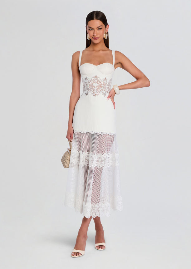 Olenna Dress in white with a lace waist and sheer lace midi skirt worn by a model