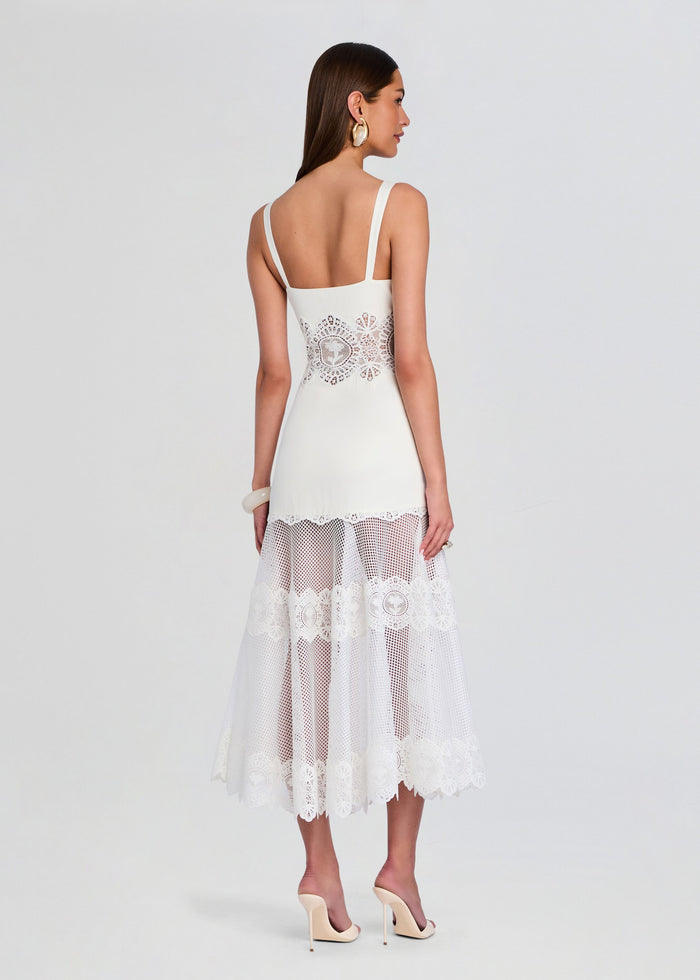 Back view of Olenna Dress in white with a lace panel at the waist and a sheer lace midi skirt. media 4 of 5