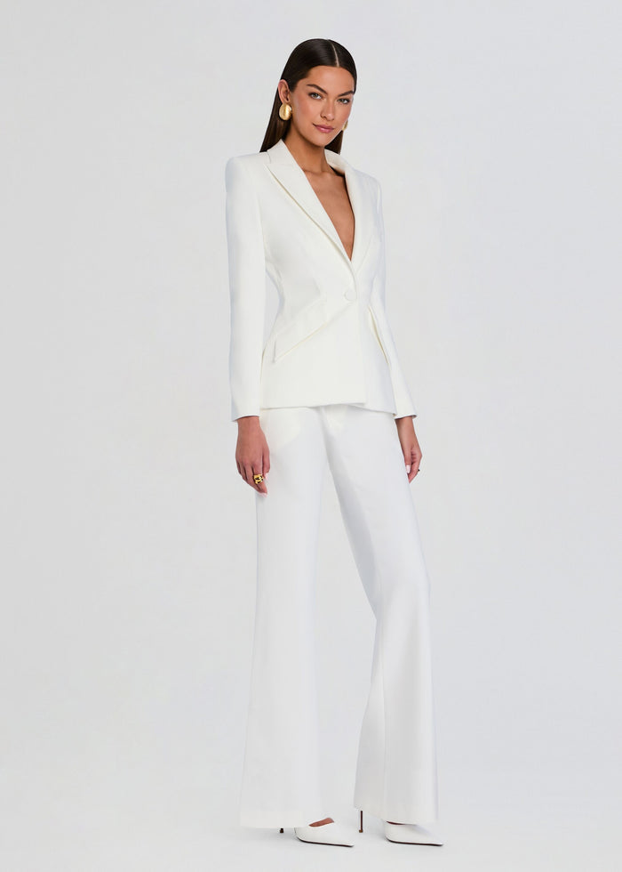 Model wearing white pin tuck palazzo pants with matching blazer media 4 of 5