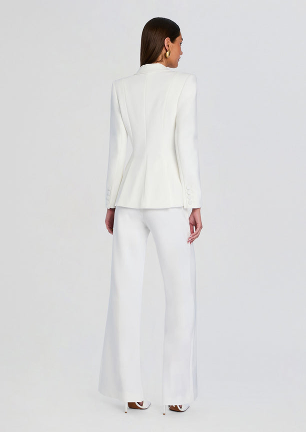 Back view of a model in a white Pin Tuck Palazzo Pants suit with blazer