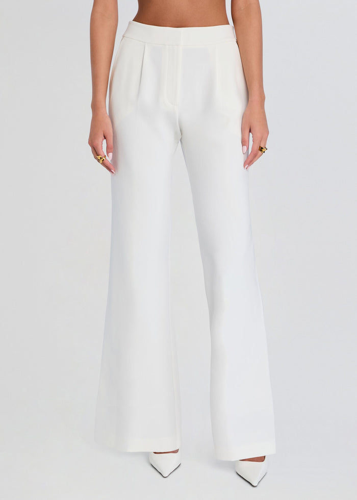 Front view of white pin tuck palazzo pants with a high waist and wide legs. media 1 of 5