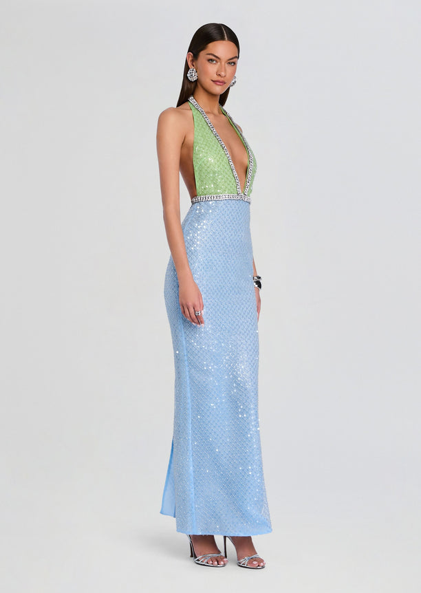Model wearing a lime green sequin halter bodice with crystal trim and a light blue sequined floor-length skirt.