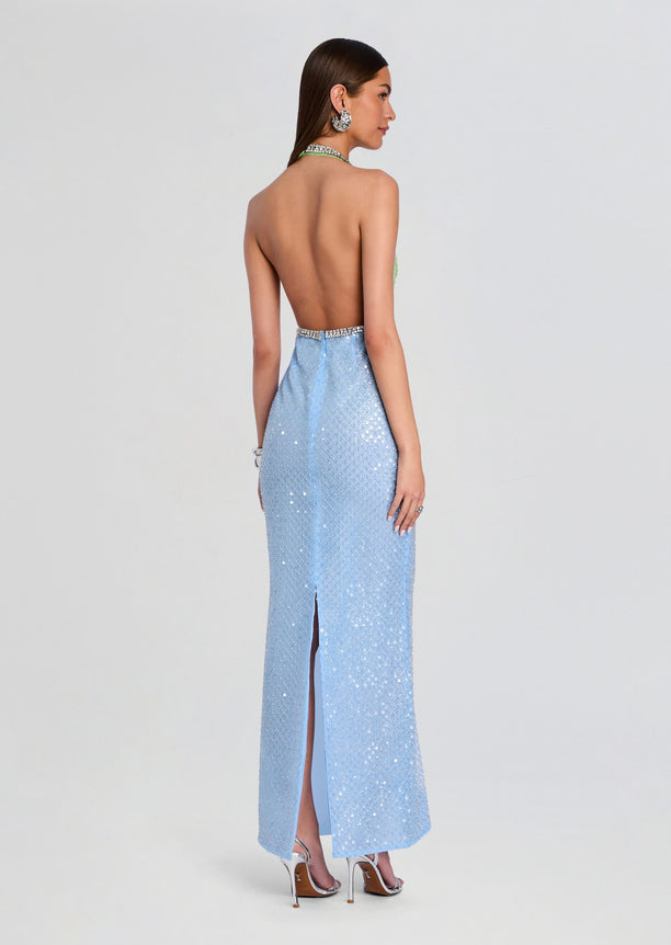 Back view shows open back halter bodice with crystal belt and a light blue sequin skirt.
